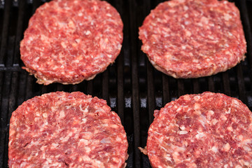 Preparing a batch of  grilled ground beef patties or frikadeller