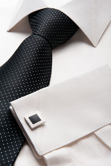 White men shirt with a black tie