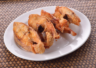 fried fish on white plate