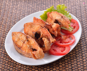 fried fish on white plate