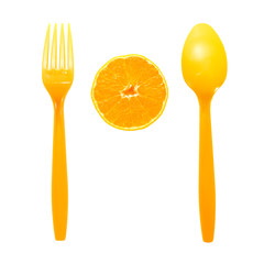 orange with spoon on white background.