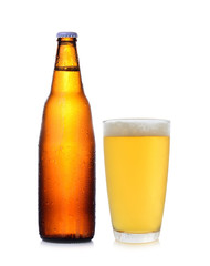 A bottle and glass of beer isolated on white