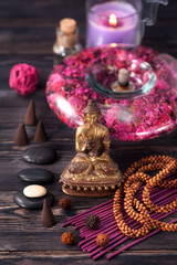 Obraz premium Buddha statue, zen stones and incense. concept of meditation