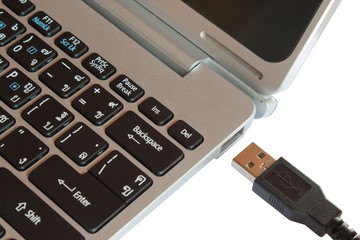 Mini laptop focus on USB port isolated on white background