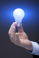 Businessman Holding a Light Bulb