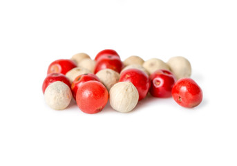 pink and white pepper is isolated on white background, closeup