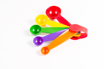 colorful measuring spoons isolated on white background