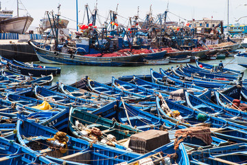 blue fishing boats in the port of Essaouira, Morocco