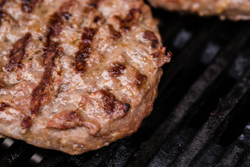 Preparing a batch of  grilled ground beef patties or frikadeller