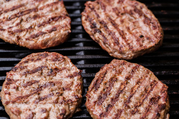 Preparing a batch of  grilled ground beef patties or frikadeller