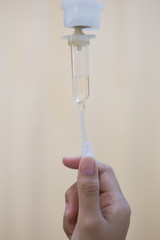 Nurse adjusting IV drip rate