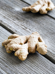 Fototapeta premium Dry ginger on rustick background close-up