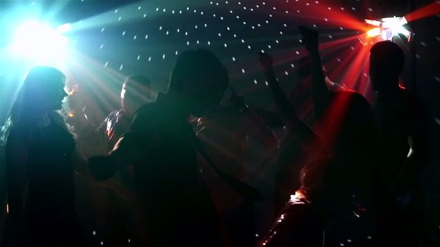 pair dancers dancing in spotlight at the club, silhouette, sexy