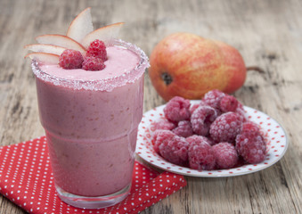 Fruit - berry smoothies with  pear and raspberries with yogurt .