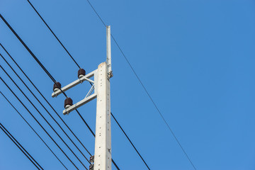 Fototapeta premium electricity post with clear blue sky