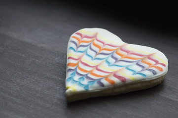 Sweet candy heart on old wooden table