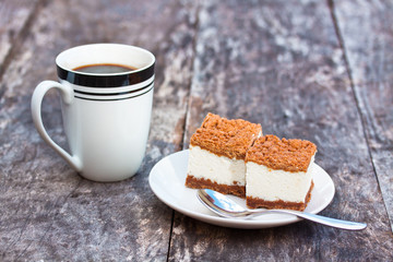 homemade tiramisu on the table with coffee mug