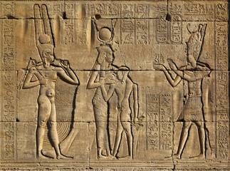 Hieroglyphic carvings in ancient egyptian temple