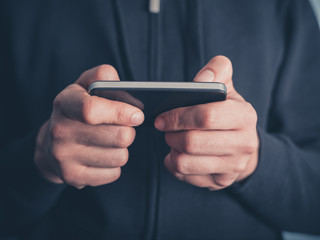 Close up on man using smartphone