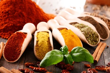 Fotobehang Kruiden Variety of spices on kitchen table