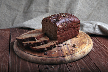 sliced traditional bread  on a wooden cutting board