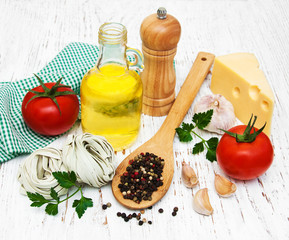 olive oil,  fettuccine nest, garlic and tomatoes