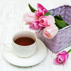 Cup of tea and pink tulips