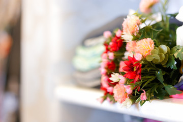 Flower Bouquet on Clothing Shelf