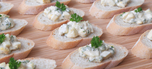 Egg salad served on slices of a baguette