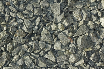 The texture of coarse gravel