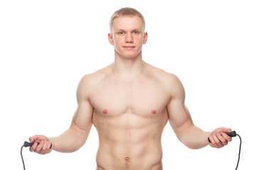 one caucasian man exercising jumping rope in silhouette studio