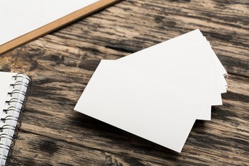 Mockup. Blank white business cards on wood background