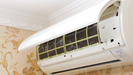 Air conditioner indoor unit opened for maintenance