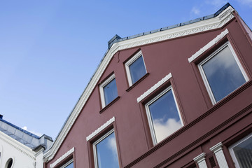 Painted Builing with Windows Reflecting the Blue Sky old Town St