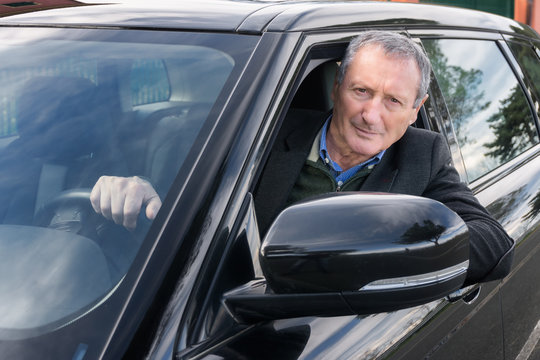 Senior Business Man Driving Car