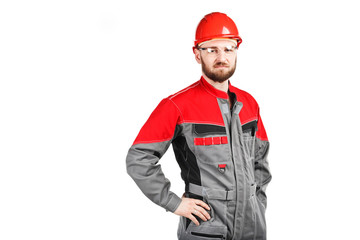 man wearing overalls with red helmet