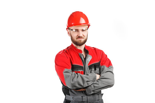 Man Wearing Overalls With Red Helmet