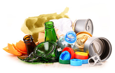 Recyclable garbage consisting of glass, plastic, metal and paper - obrazy, fototapety, plakaty