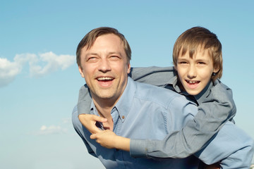 cheerful father and son