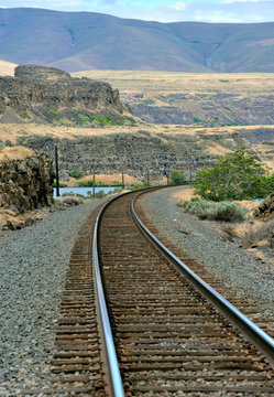 Railroad tracks running along banks of the Columbia River.
