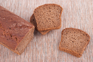 Fresh bread on the tablecloth.