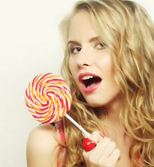 blond  girl with  lolipop