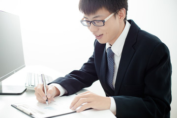 Businessman analyzing investment charts. Accounting