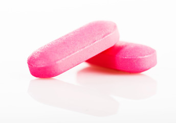 Group of pink medical pills isolated