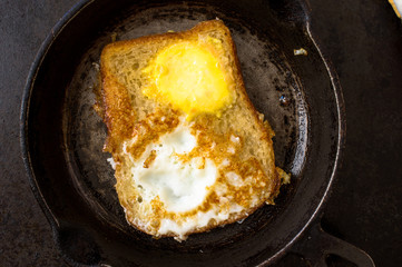 Frying pan with a sandwich with egg