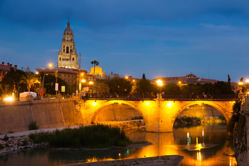 Fototapeta na wymiar stone bridge over Segura river in evening. Murcia