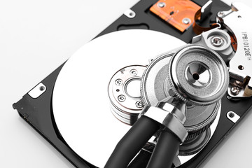 stethoscope on the hard disk drive over white