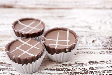 Dark chocolate on wooden background