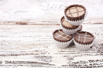 Dark chocolate on wooden background