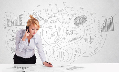 Business woman at desk with hand drawn charts